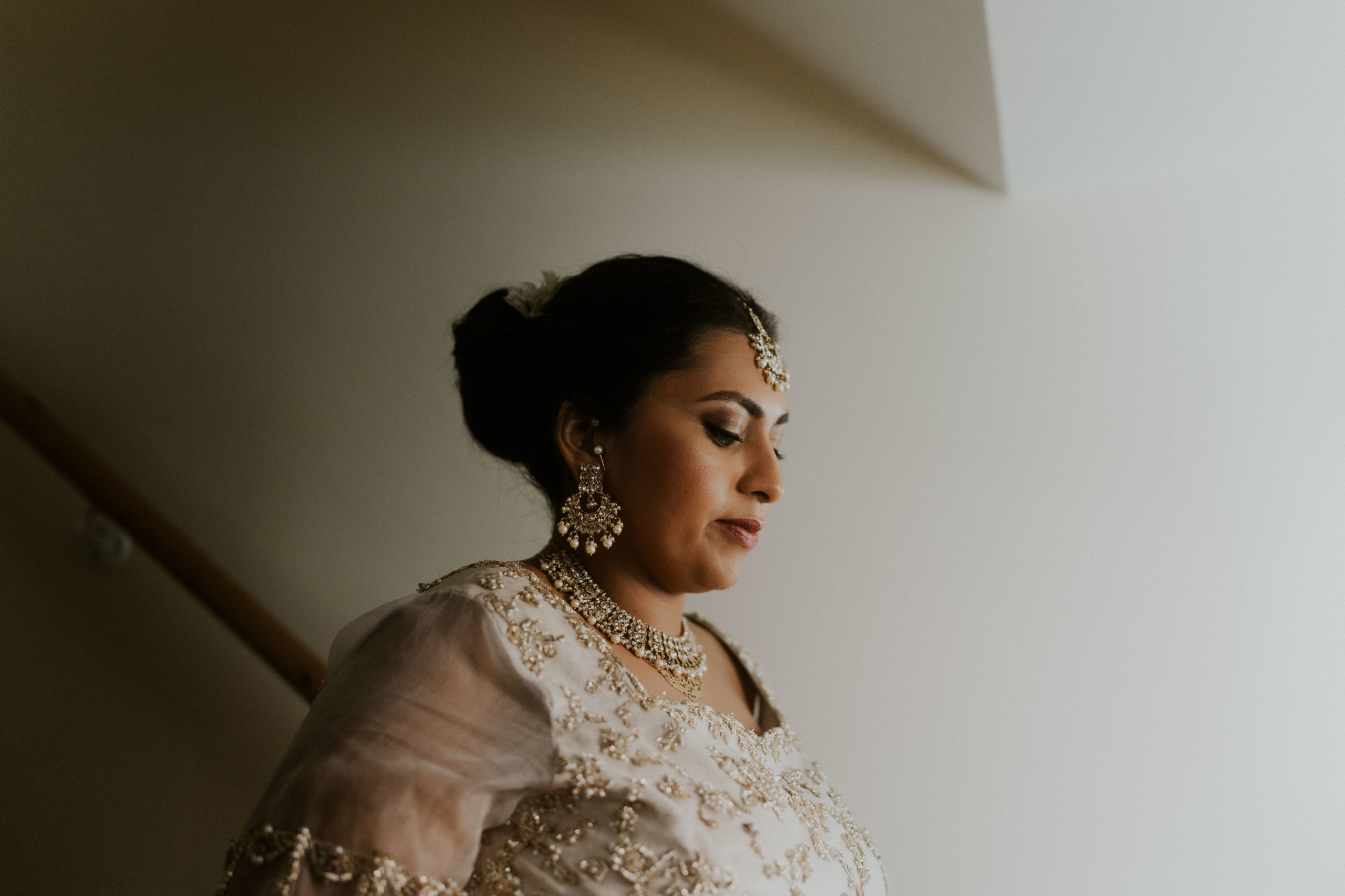 bride getting ready in the morning at home with her family 