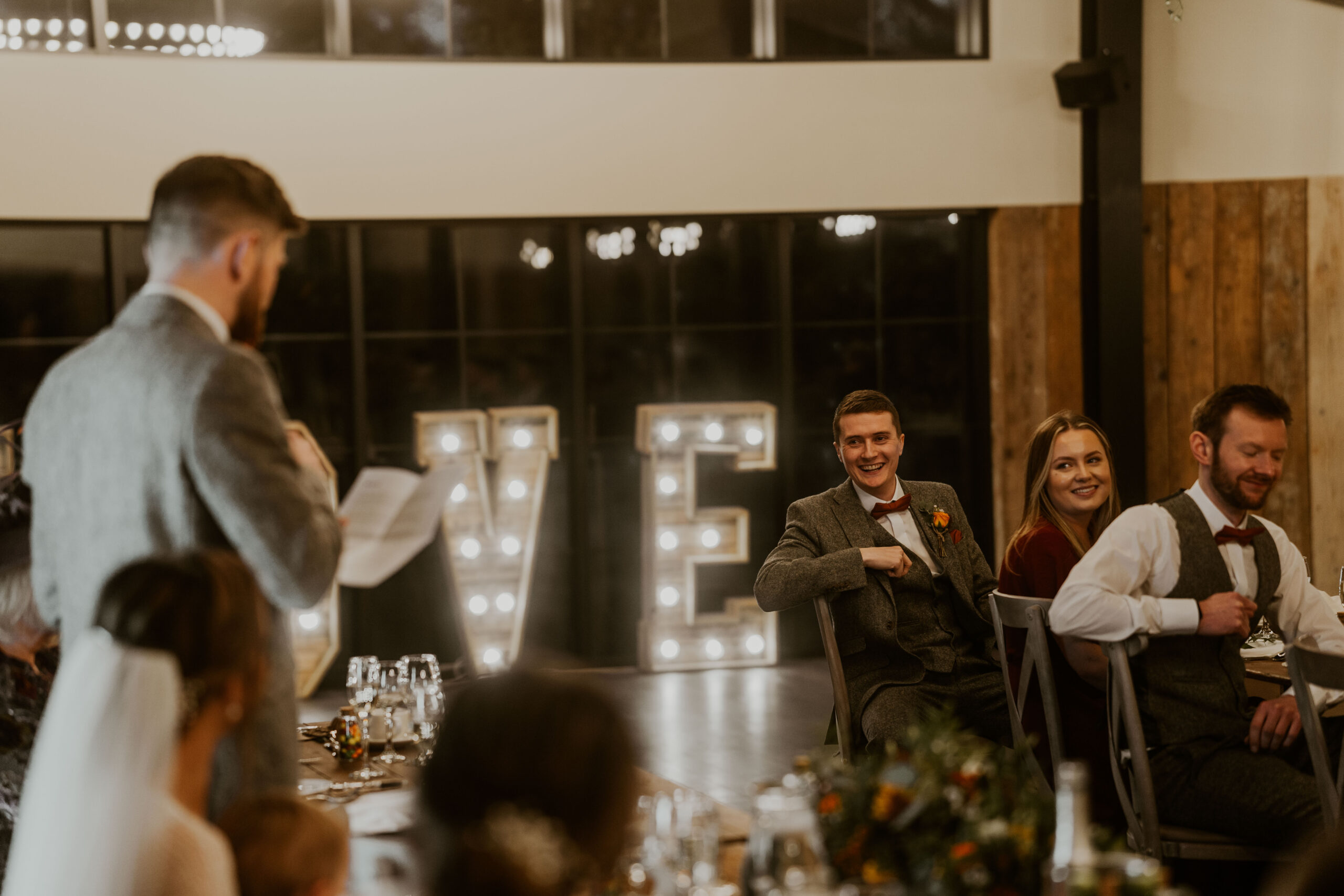 wedding guests laughing in speeches