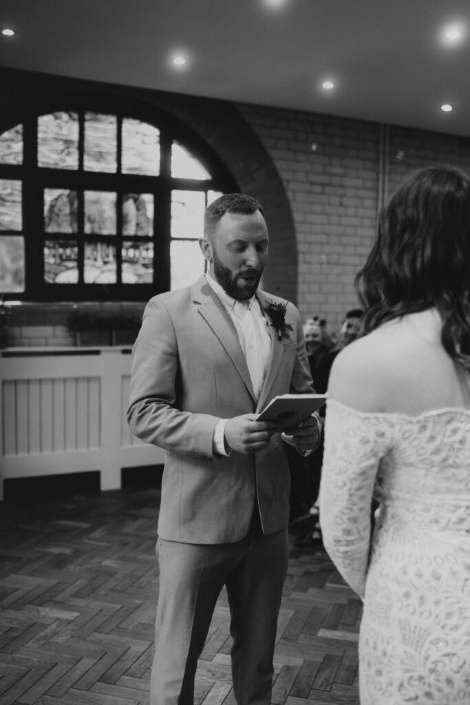 Groom Reading Vows To Bride at Wedding Ceremony at The Pumping House, Ollerton. Wedding Photographer