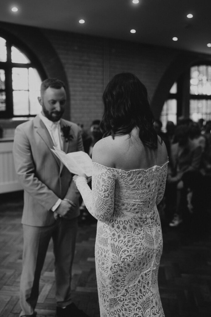 Bride Reading Vows To Groom at Wedding Ceremony at The Pumping House, Ollerton. Wedding Photographer