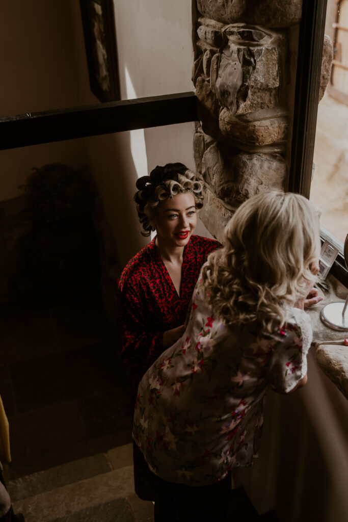 Alternative bride helping her mum get ready in the morning at Willow Marsh Farm captured by a relaxed wedding photographer
