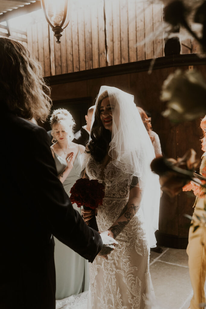 candid wedding photographer capturing alternative moody ceremony with kicks celebrant at willow marsh farm 