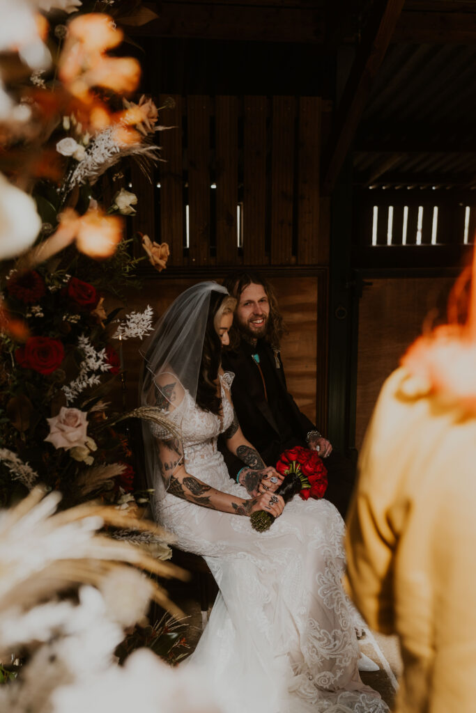 candid wedding photographer capturing alternative moody ceremony with kicks celebrant at willow marsh farm 