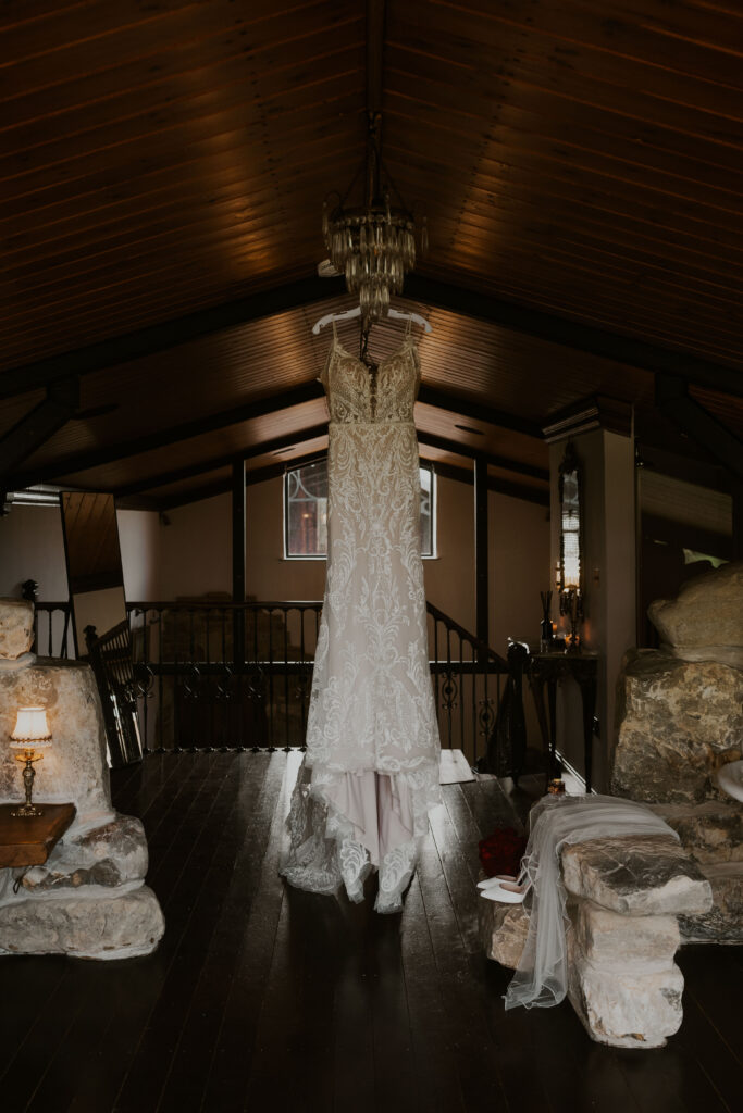 Alternative brides dress hanging from the suite at Willow Marsh Farm 