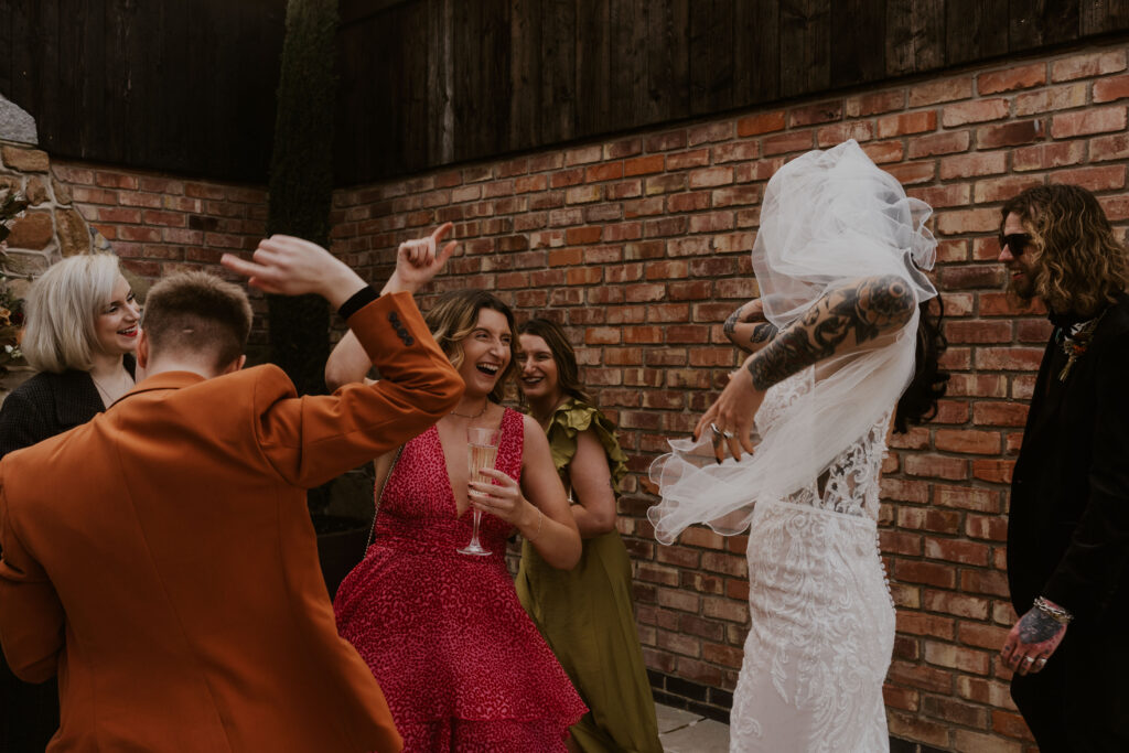 relaxed wedding photographer capturing alternative creative wedding celebrations at willow marsh farm