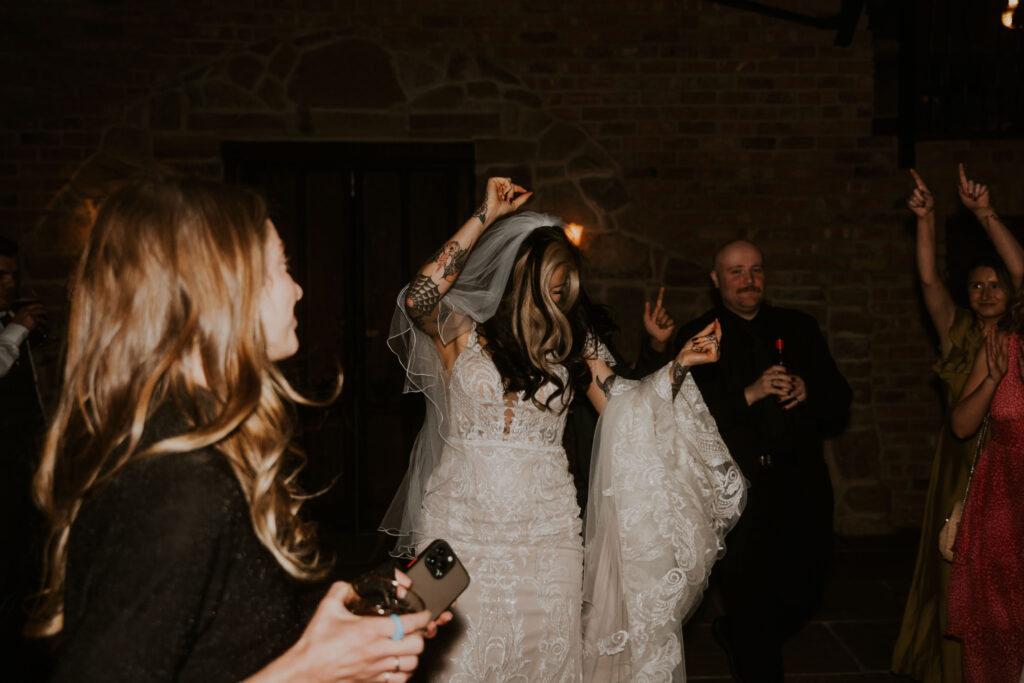 flash wedding photographer capturing  evening wedding celebrations at willow marsh farm