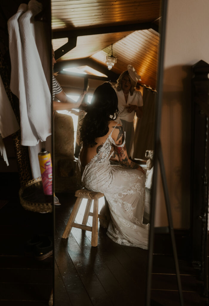 alternative wedding photographer capturing cool brides wedding prep using the natural light and moody tones at willow marsh farm