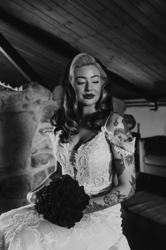 alternative wedding photographer capturing cool brides wedding prep portrait of bride in black and white at willow marsh farm