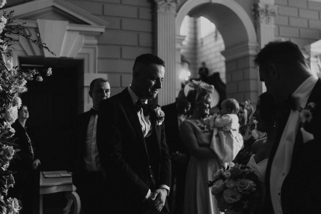 grooms heartfelt reaction to bride walking down the isle with her father at davenport house