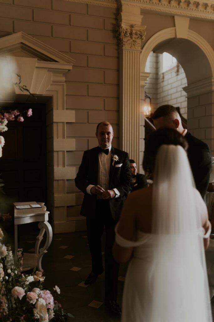 candid wedding photography capturing a beautiful, floral wedding ceremony at davenport house 