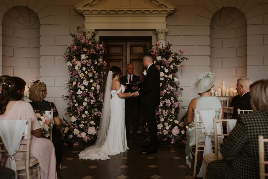 candid wedding photography capturing a beautiful, floral wedding ceremony at davenport house 