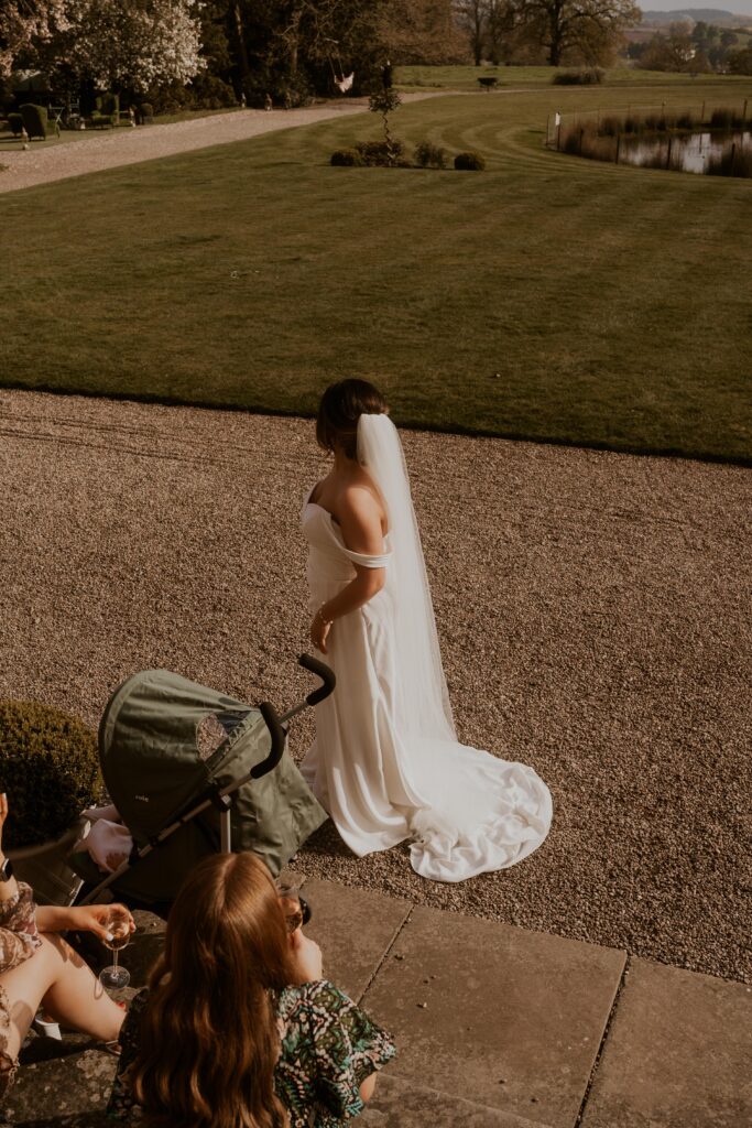 The bride radiating elegance in her stunning wedding gown, capturing the beauty and grace of the special day.