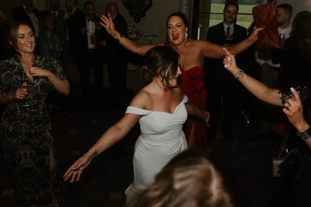 arty and candid flash photography of fun wedding evening celebrations and dancing at davenport house