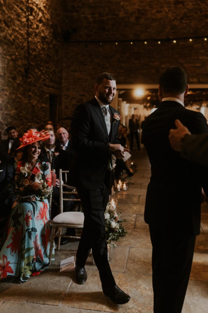 bride and groom laughing with each other as they exchange their marriage vows at Eden Barn Wedding venue