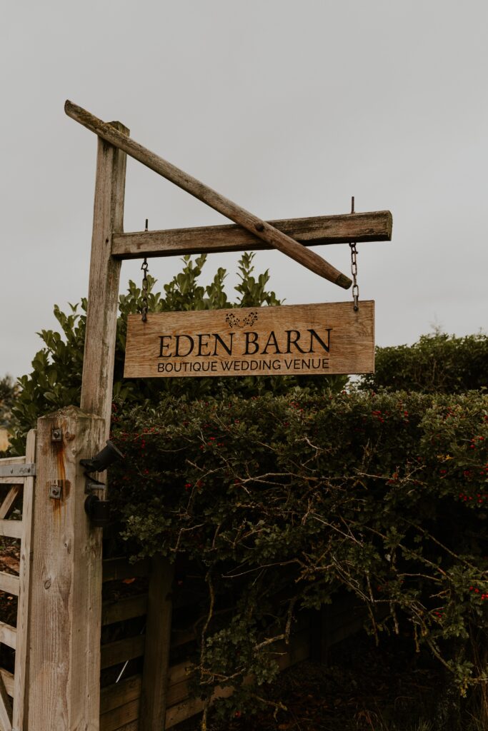 eden barn wooden wedding sign outside their venue