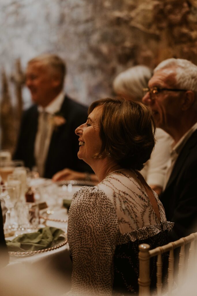 candid wedding photographer capturing natural reactions at the speeches at eden barn