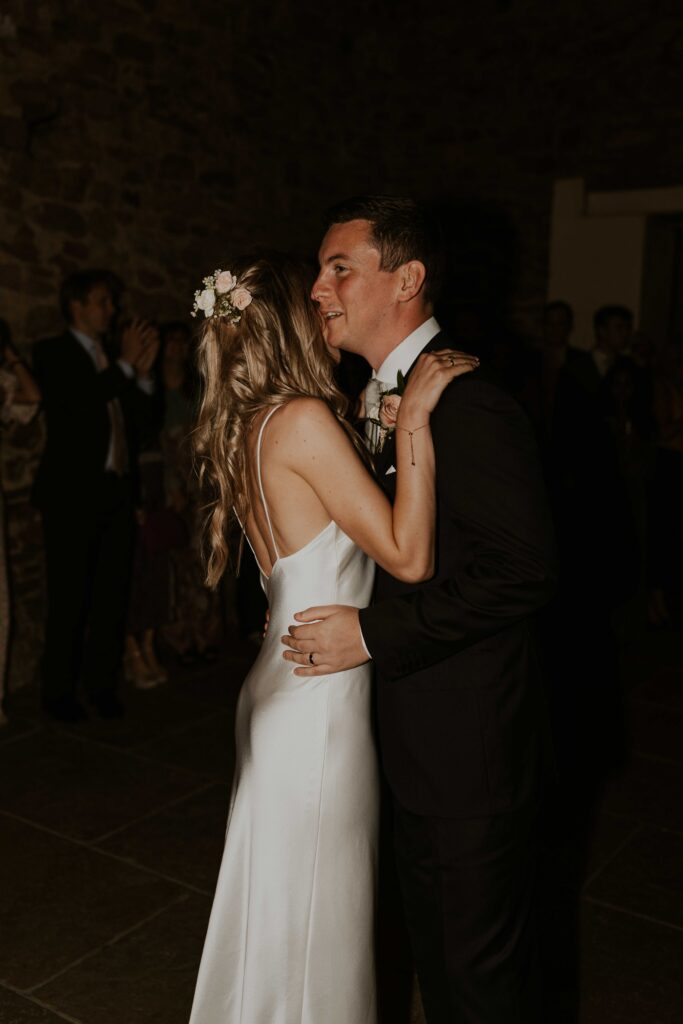 the bride and groom having a blast during their first dance at Eden barn
