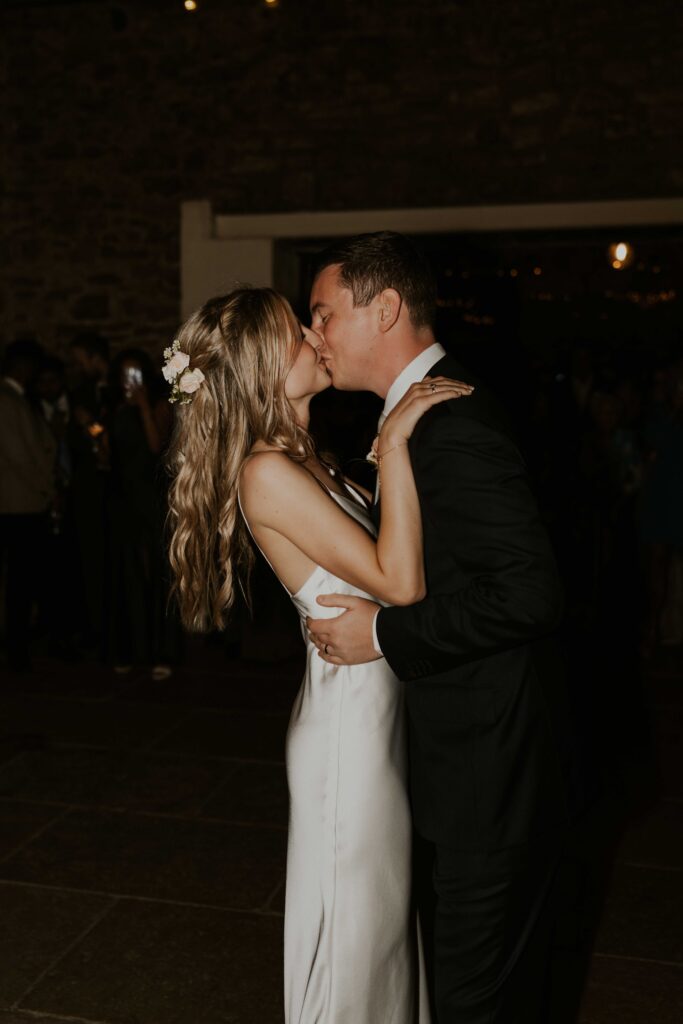 the bride and groom having a blast during their first dance at Eden barn