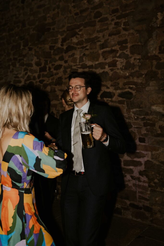 fun wedding flash photography capturing guests dancing and having fun at the evening reception at eden barn