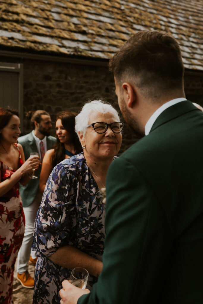 after the ceremony mingling at tithe barn wedding venue 