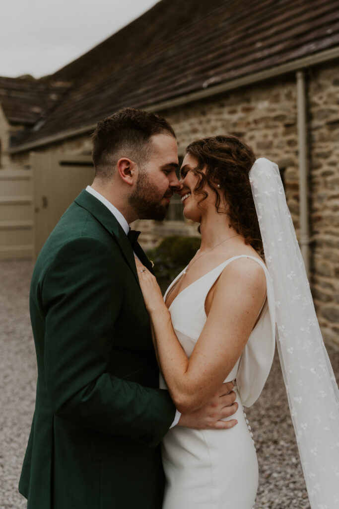 Candid and relaxed couple shoot at tithe barn wedding venue 