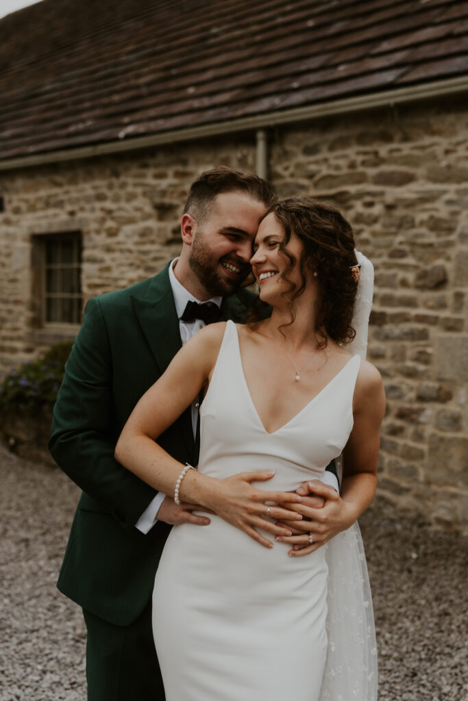 Candid and relaxed couple shoot at tithe barn wedding venue 