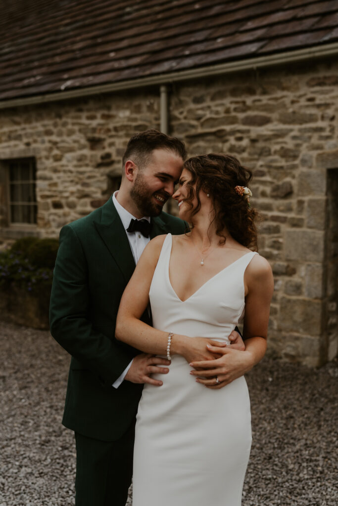 Happy and relaxed couple shoot at tithe barn wedding venue 