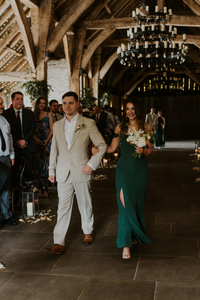 wedding ceremony at tithe barn captured by a relaxed wedding photography and videographer team 
